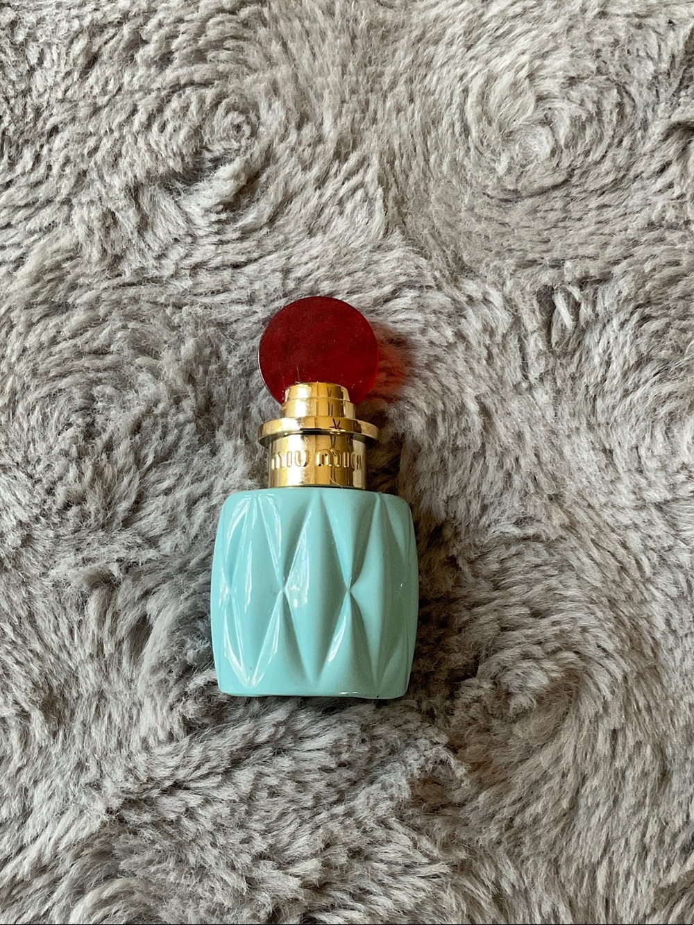 Miu Miu Turquoise Bottle of Fragrance